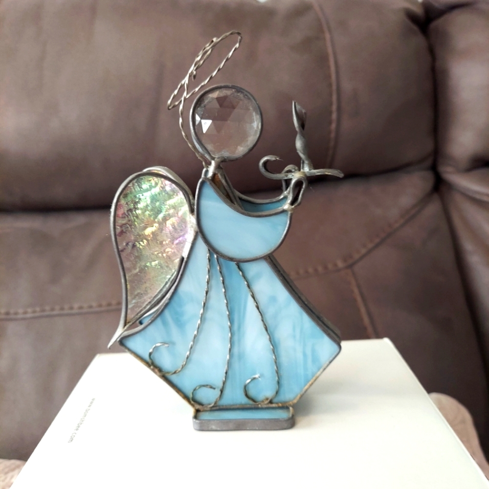 Blue and white angel with halo On Base Holding Candle